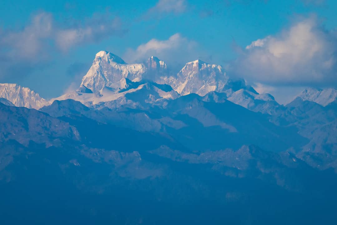 Snow-covered Himalayan peaks seen from the road between Thimphu and Punakha