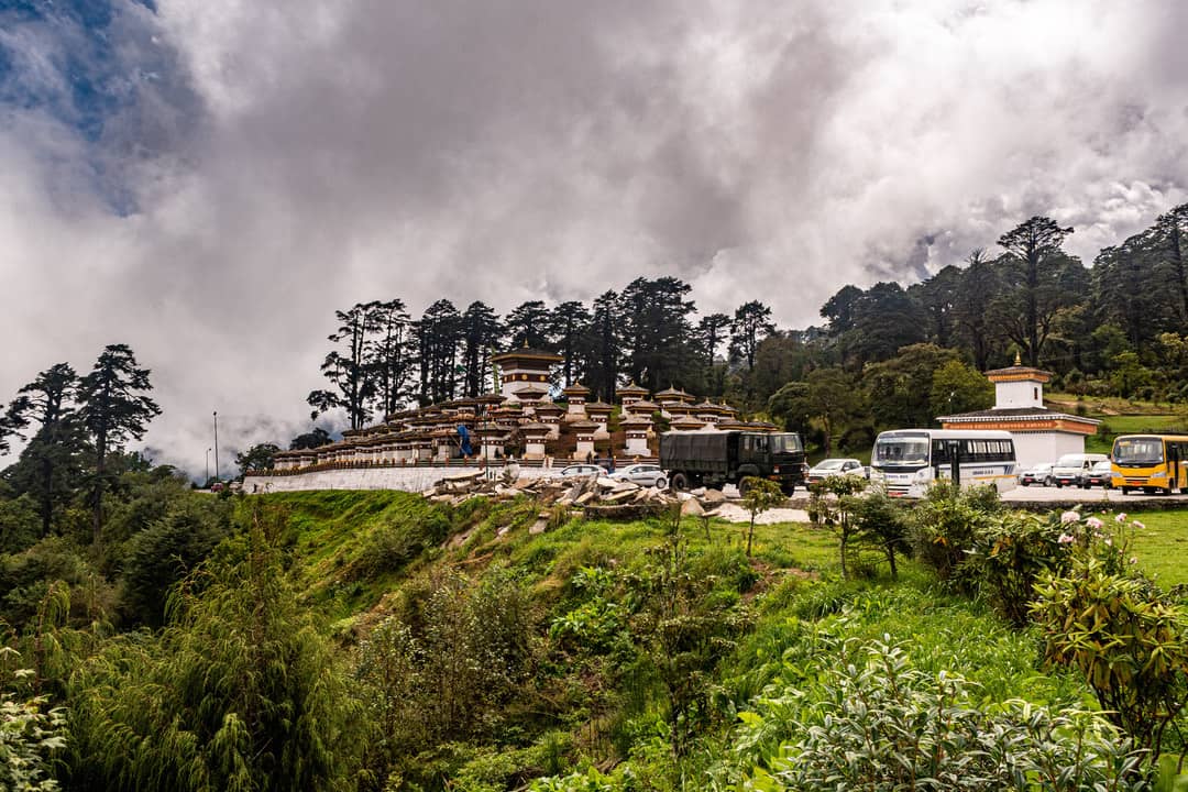 The 108 Druk Wangyal Chortens at Dochula Pass beneath a cloudy Himalayan sky