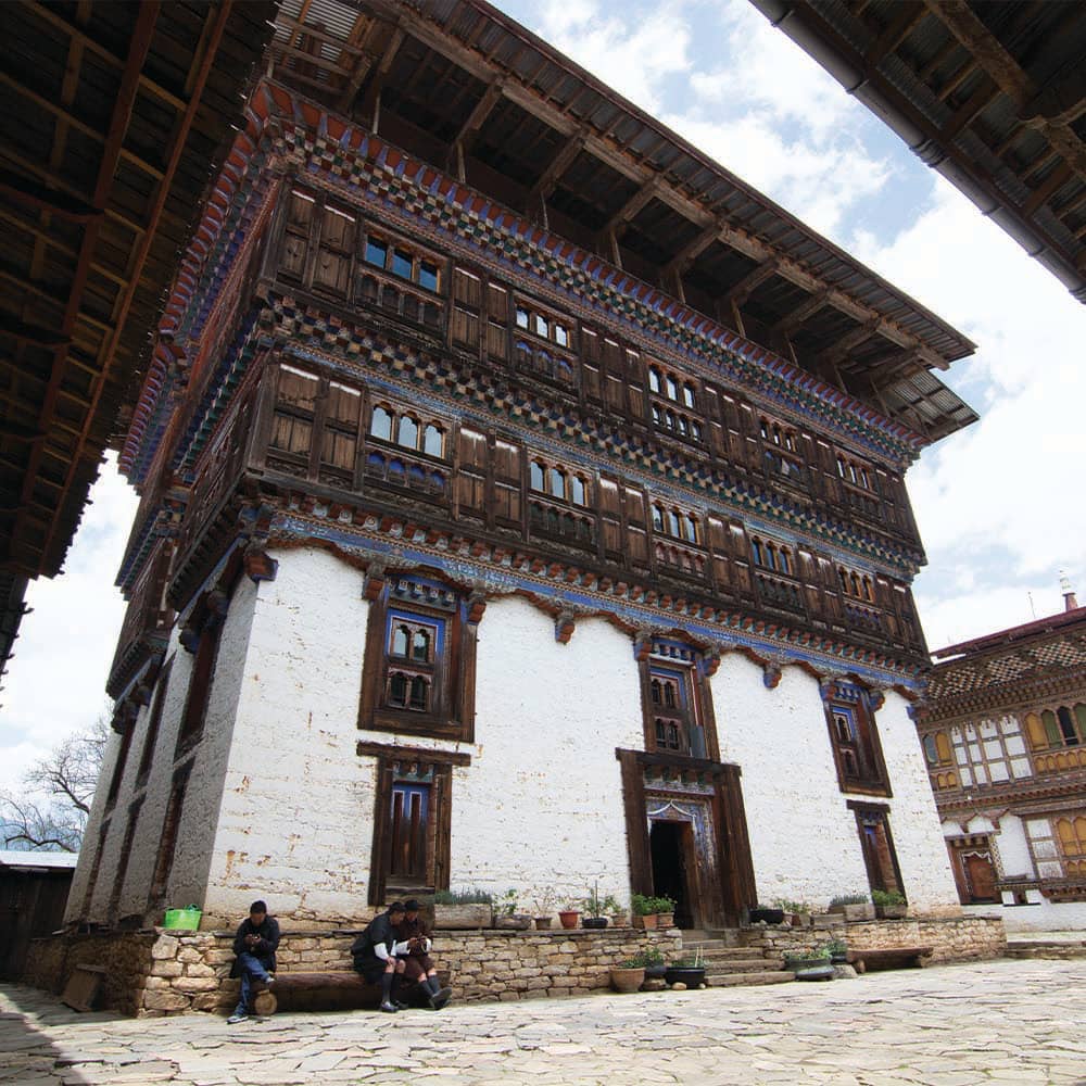 Traditional timber architecture surrounding the Ogyen Choling museum courtyard