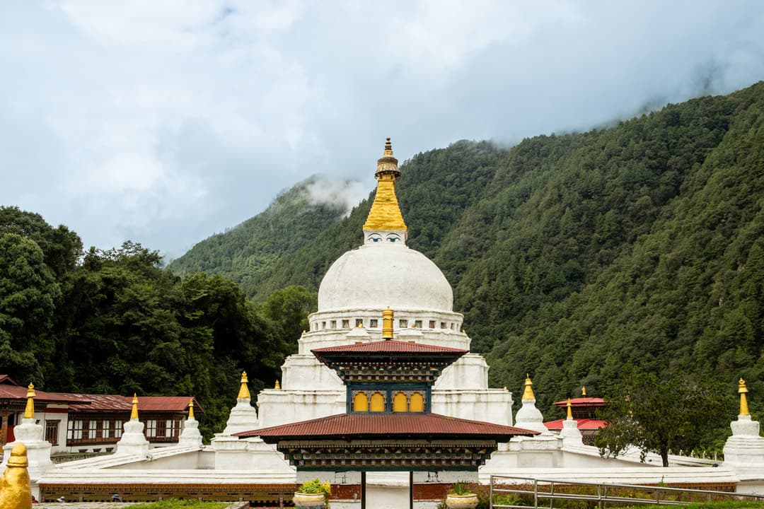 Chorten Kora framed by the forested hills of Trashiyangtse