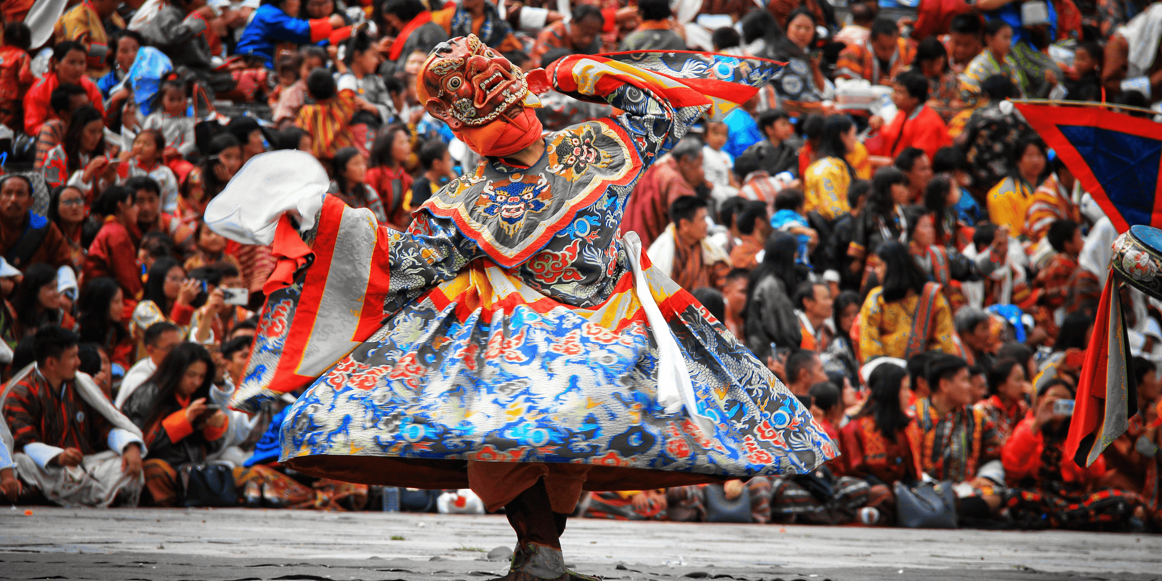 Tshechu festival dancers in traditional masks