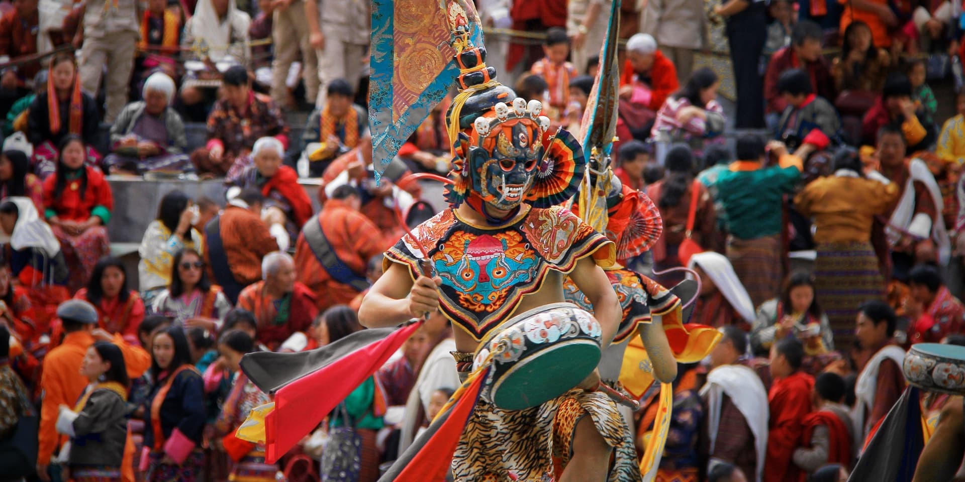 Masked dancer performing during a Bhutanese Tshechu festival